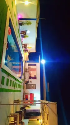 a cruise ship at night with its lights on at Grand farm