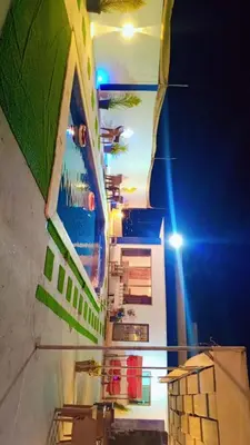 a view of a building at night with at Grand farm