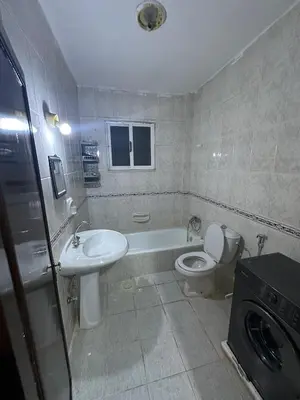 a bathroom with a sink and a toilet and a tub at Beautiful apartment in Irbid