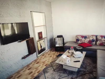 a living room with a couch and a coffee table at الدوار السابع in Amman