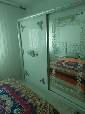 a room with a bed in a glass wall at Dream Home furnished Apartment in Amman