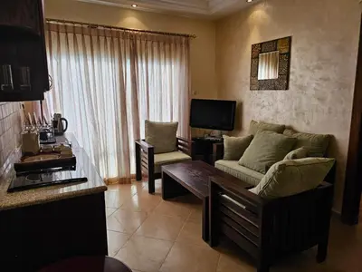 a living room with a couch and a table at Swemeh hills resort in Sowayma