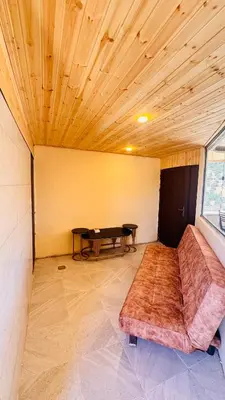 a living room with a couch and a table at عجلون - ajloun اشتفينا -9 in Ajloun