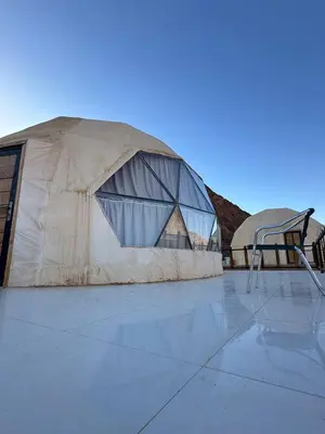 a building with a basketball hoop in front of it at Camp Imran Khan Wadi Rum in Aqaba