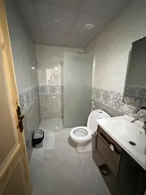 a bathroom with a toilet and a shower and a sink at Camp Imran Khan Wadi Rum in Aqaba