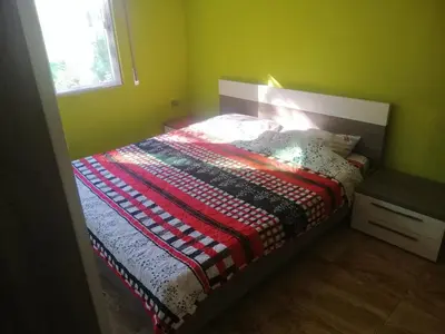 a bedroom with a bed with a quilt on it at Humble house in Amman