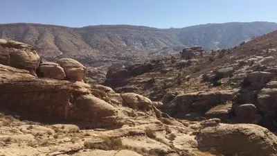 a view of a canyon with rocks and mountains at Tafila-Mataan in Al Jafr