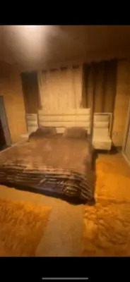 a blurry picture of a bed in a room at Moose house in Ajloun