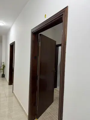 an open door with a mirror in a hallway at Modern Apartment in Prime Location - Jabal Amman in Amman
