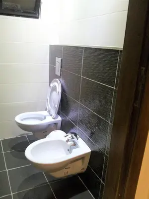 a bathroom with a sink and a toilet in it at Family apartment in Abdoun Al Janobi in Amman