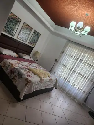 a bedroom with a bed and a window at 4th circle embassy district 2 bedrooms الدوار الرابع حي السفارات in Amman