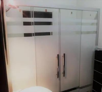 a white cabinet in a bathroom with a toilet at Apartment in Abdoun Al Janobi in Amman