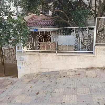 a fence on the side of a building at Bourbaki house