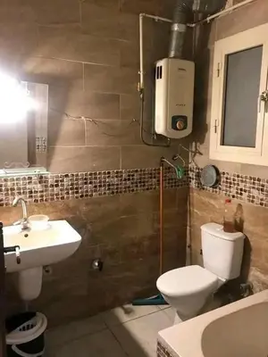 a bathroom with a toilet and a sink at المناخير هوستل in Amman