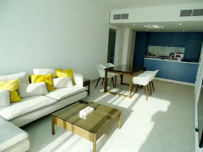 a living room with a couch and a table at B12 beach apartment Ayla in Al Jafr