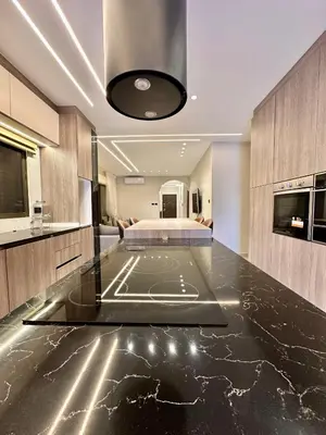 a room with a bed and a glass counter top at Modern Residence for families only in Amman