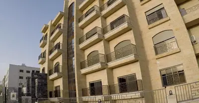 a large building with balconies on the side of it at Apartment in Amman 7th Circle near Cozmo market in Amman
