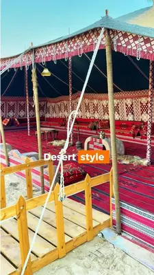 a stage with a sign that reads desert style at Ras Al Khaimah Farm & Resort