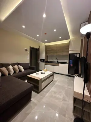 a living room with a couch and a table at Charming Amman Apartment with Modern furnis in Amman
