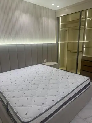a bedroom with a bed in a room at Apartment in dergbar in Amman
