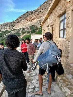 a group of people standing outside of a building at Friends of Dana Hotel in Dana