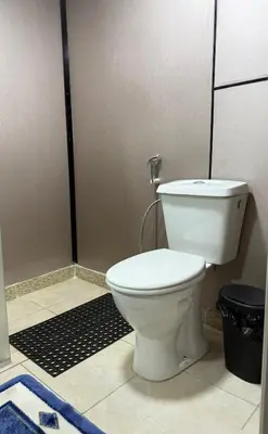 a bathroom with a white toilet in a room at sky view rooftop in Amman