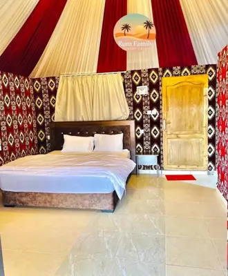 a bedroom with a bed in a circus tent at RUM fAMILY lUXURY CAMP in Wadi Rum