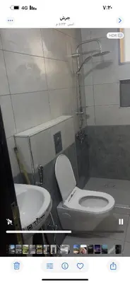 a bathroom with a toilet and a sink at مزرعة وفيلا غابة الارز in Jerash