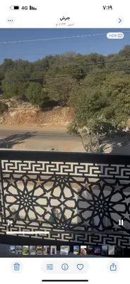 a page of a website with a picture of a bridge at مزرعة وفيلا غابة الارز in Jerash