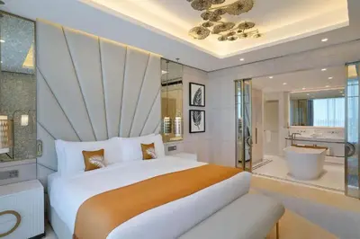 a bedroom with a large bed and a bathroom at الأردن عمان in Irbid