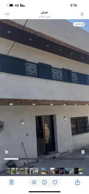a picture of a building with a gold door at فيلا مفروشه ومزرعه للايجار in Jerash