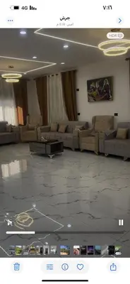 a large living room with couches and a table at فيلا مفروشه ومزرعه للايجار in Jerash