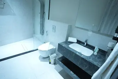 a bathroom with a sink and a toilet at Roya Downtown Boutique Hotel in Amman