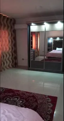 a bedroom with a large mirror and a bed at Althemar Hotel Ajloun -Jordan By Enala Hotels Group in Ajloun
