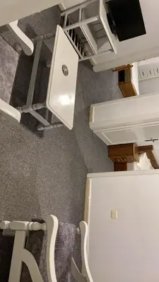 a room with a desk with a tv on top at aljumirah furnished appartments الجميرا للشقق المفروشة in Az Zarqa