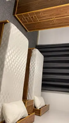 two bunk beds sitting next to each other in a room at aljumirah furnished appartments الجميرا للشقق المفروشة in Az Zarqa