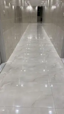a large white marble floor in a building at aljumirah furnished appartments الجميرا للشقق المفروشة in Az Zarqa