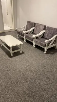 a living room with two couches and a coffee table at aljumirah furnished appartments الجميرا للشقق المفروشة in Az Zarqa