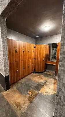 a room with wooden lockers in a building at Al-Amaari Gardens Compound 3092 in Irbid