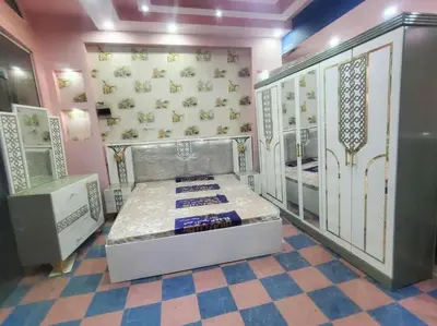 a bedroom with a bed in a room at Tea apartment in Aqaba