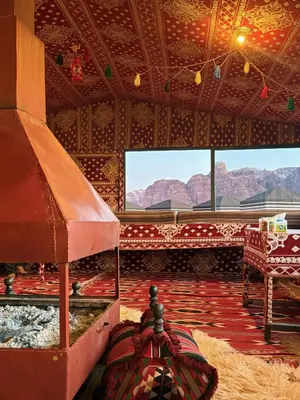 a room with a view of mountains from a room with a bed at Bubble Camp Wadi Rum in Wadi Rum