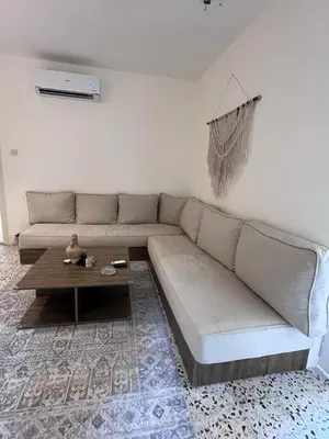 a living room with a couch and a coffee table at White castle in Aqaba