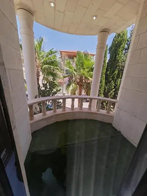 an external view of a building with a balcony at بيت محمد in Amman