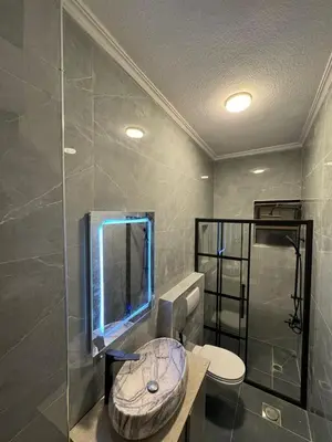 a bathroom with a sink and a shower at stay by university of Jordan in Amman