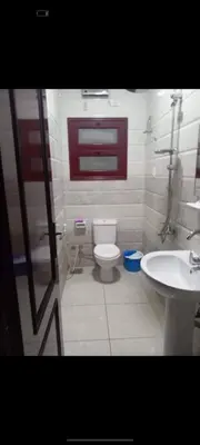 a bathroom with a toilet and a sink at اهلا وسهلا in Petra