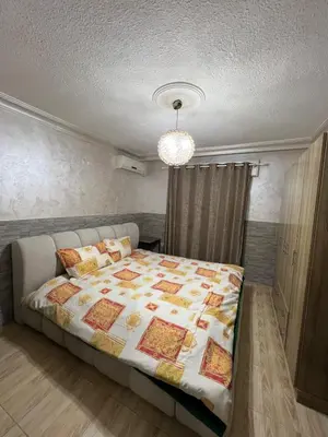 a bedroom with a large bed in a room at Central modern affordable studio in Amman
