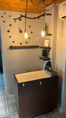a counter in a room with bats on the wall at T Cozy Chalet in Ash Shāghūr
