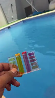 a person holding a group of different colored batteries at T Cozy Chalet in Ash Shāghūr
