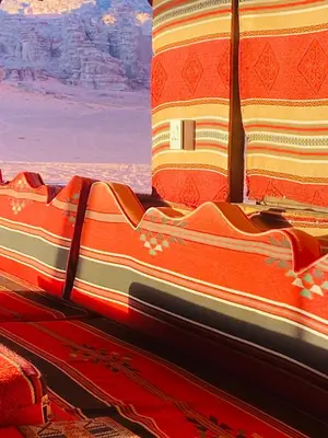 a group of blankets sitting on top of a bus at Crescent Camp & Tours in Wadi Rum