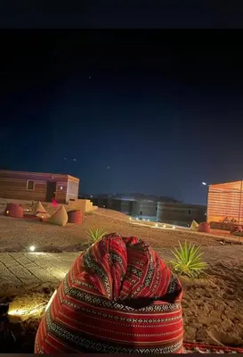 a blanket sitting on the side of a road at night at Siq Rum Luxury Camp in Wadi Rum